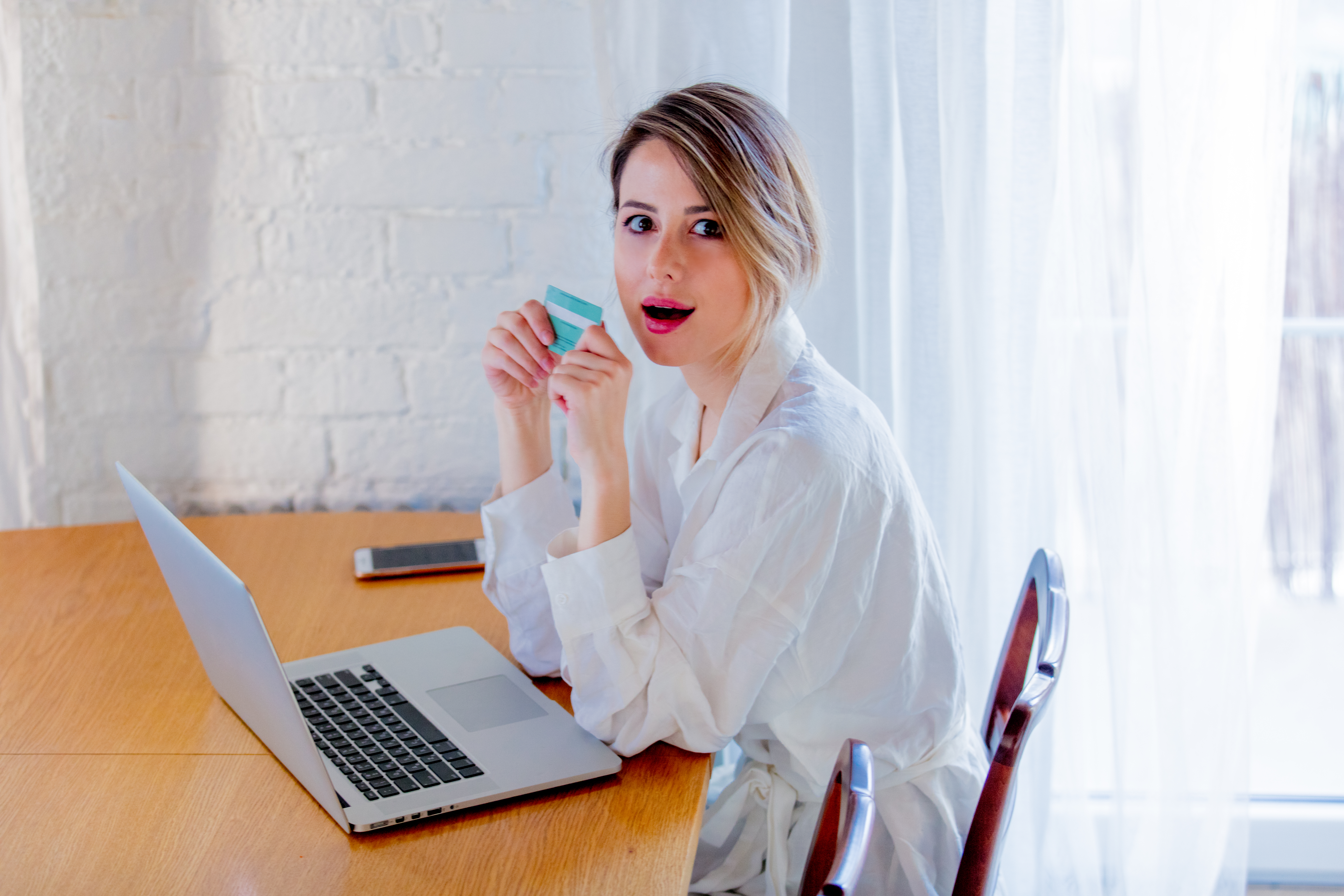 girl with laptop computer and credit card.