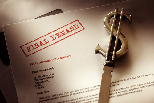 The words "final demand" stamped on a paper