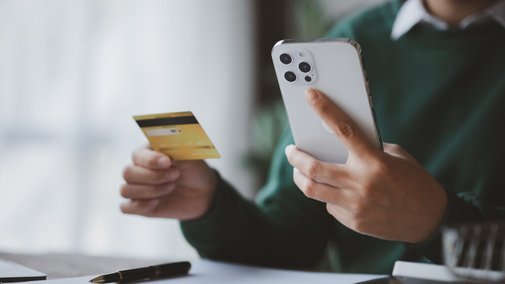 Individuals hold credit cards, pay for goods and services by cre