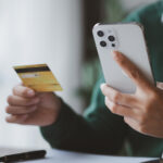 Individuals hold credit cards, pay for goods and services by cre