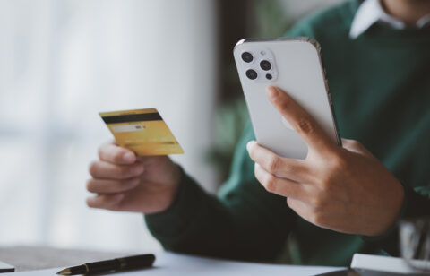 Individuals hold credit cards, pay for goods and services by cre