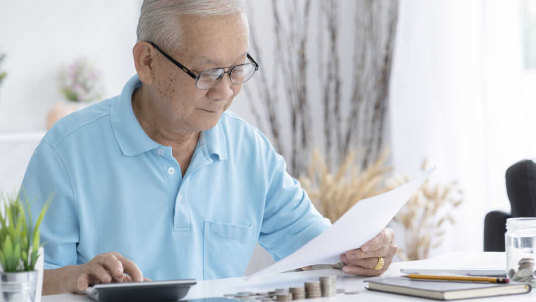 senior man looking at a tax refund