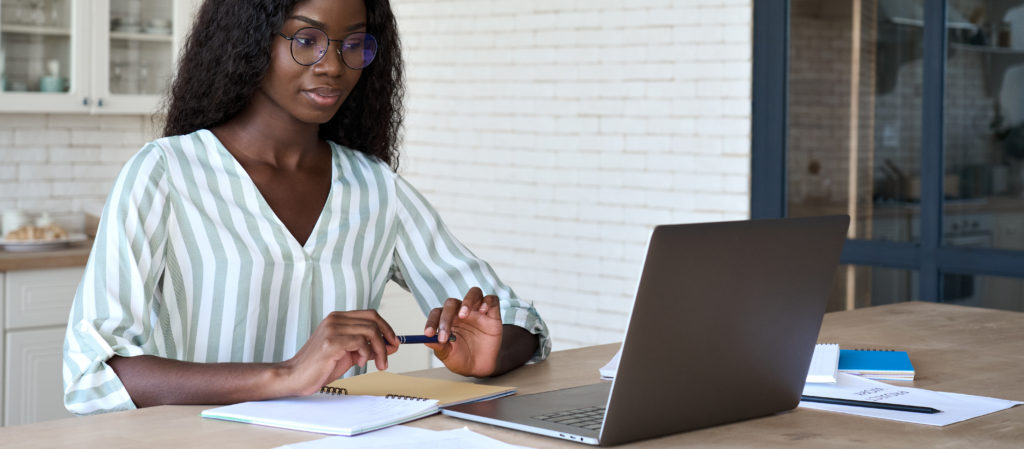woman researching common tax types on her laptop