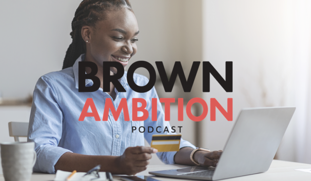 Cover art for the Brown Ambition Podcast. A woman seated in front of a laptop, holding a credit card and smiling.