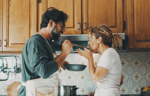 couple cooking in kitchen