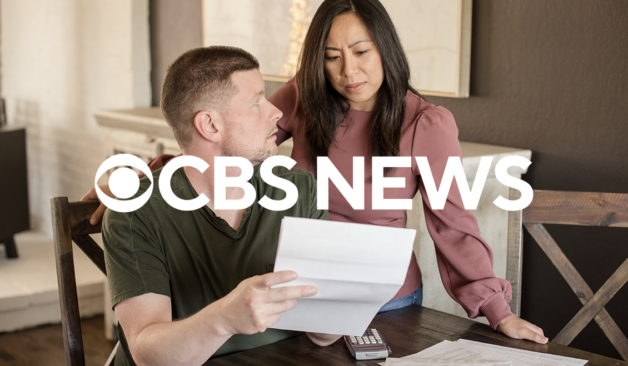 CBS News logo overlayed on image of two people discussing financial paperwork
