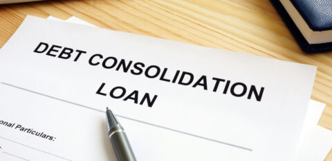 paper with debt consolidation loan typed on top