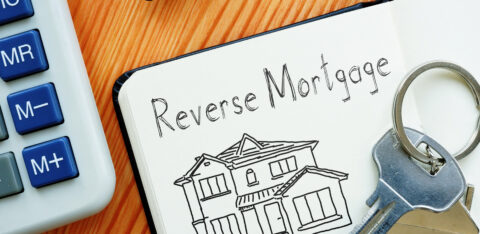 whiteboard showing a home and reverse mortgage signage