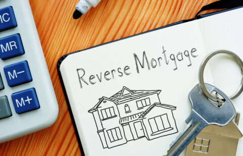 whiteboard showing a home and reverse mortgage signage