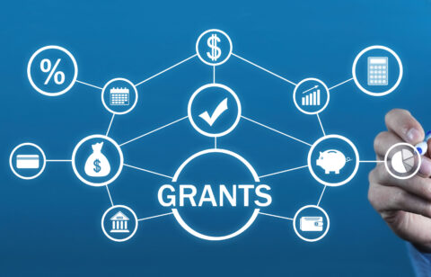A digital diagram illustrating financial grants, with interconnected icons representing money, banking, interest rates, savings, and budgeting.