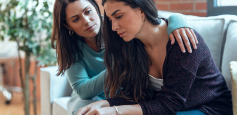 woman comforting her friend
