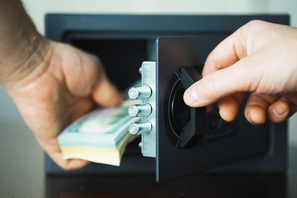 putting money away in a safe