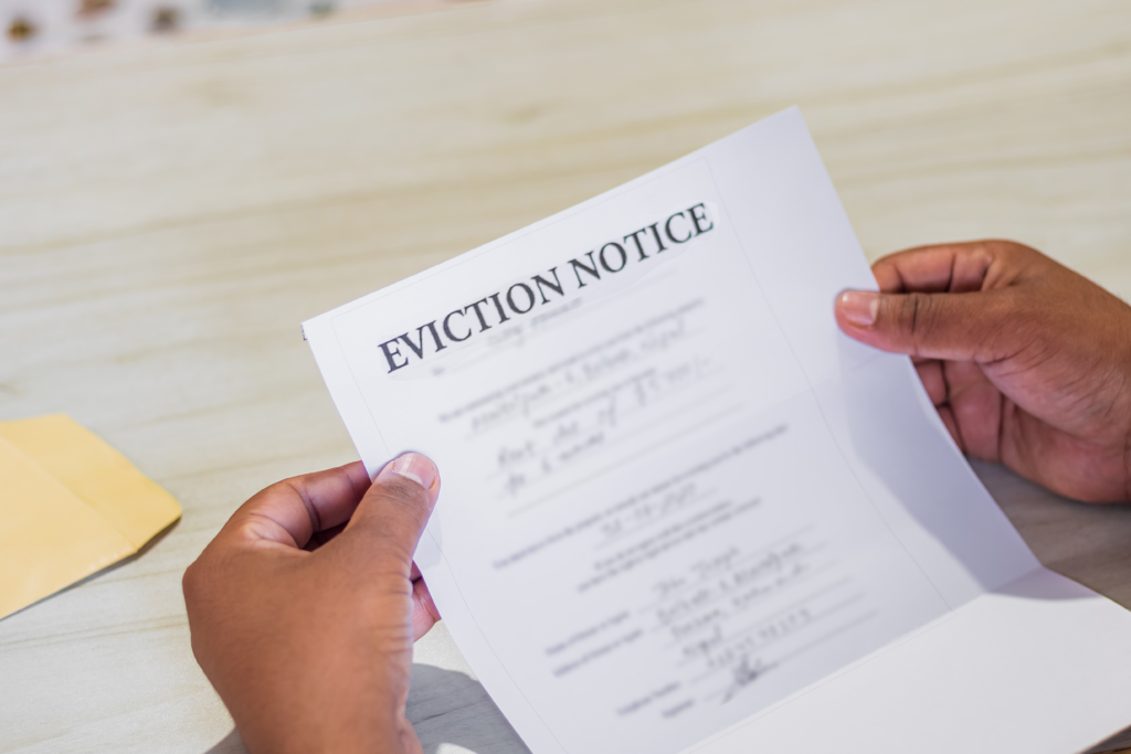Close-up of hands holding an eviction notice letter