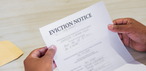 Close-up of hands holding an eviction notice letter