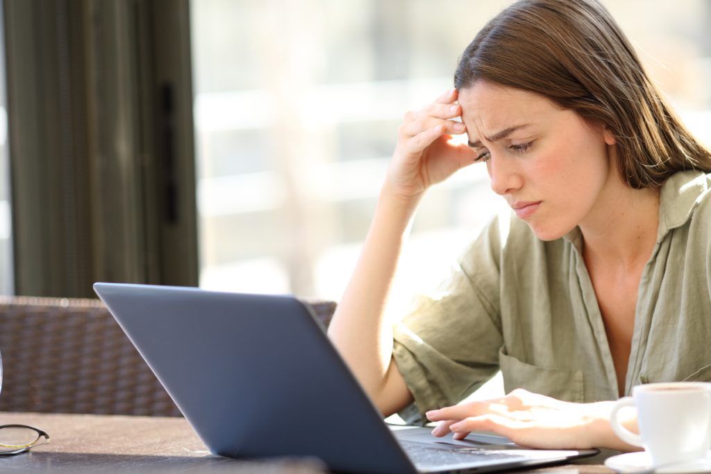 concerned woman looking at computer