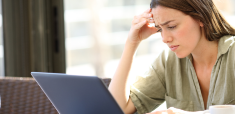 concerned woman looking at computer