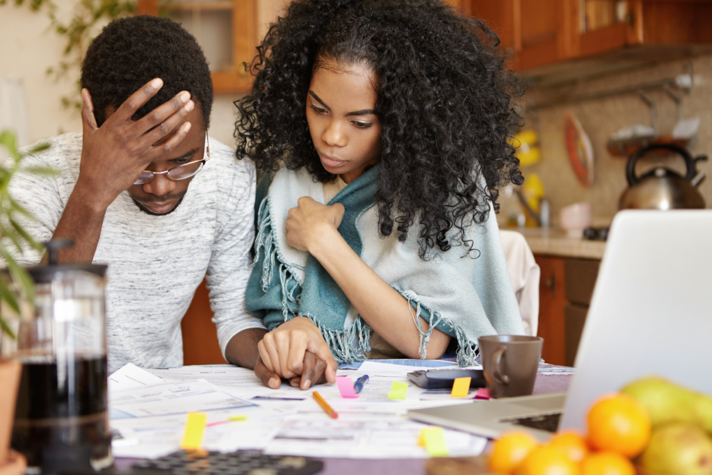 a couple looking over bills