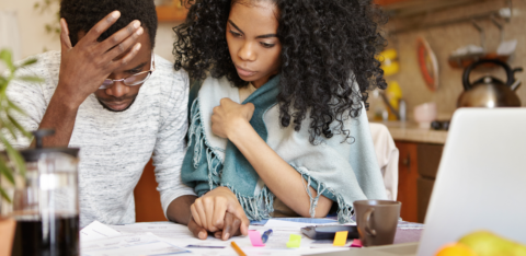a couple looking over bills
