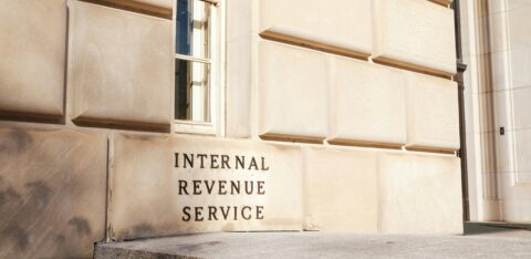 Exterior of the Internal Revenue Service building with engraved signage and classic stone architecture.