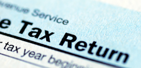 Close-up of a U.S. tax return form showing the words 'Tax Return' in bold text.