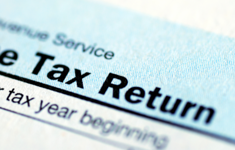 Close-up of a U.S. tax return form showing the words 'Tax Return' in bold text.