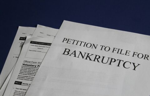 Close-up of U.S. bankruptcy forms, including a petition to file for bankruptcy.