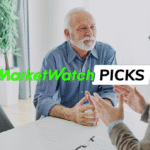 An older man talks with a financial professional across a desk in an office, with the text “MarketWatch Picks” displayed over the image.