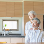 two older adults in a kitchen