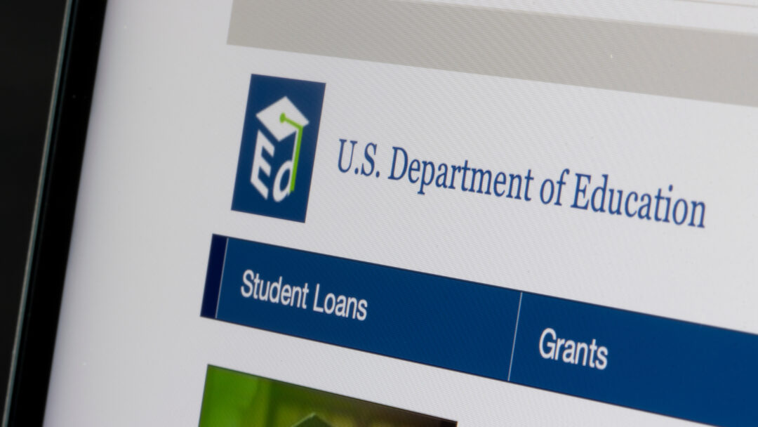 Close-up of the U.S. Department of Education website showing navigation for student loans and grants